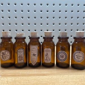 SIX Small Brown Glass Bottles with Varying Apothecary Stickers Attached